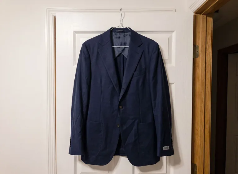 Navy blazer on a hanger: the original photo