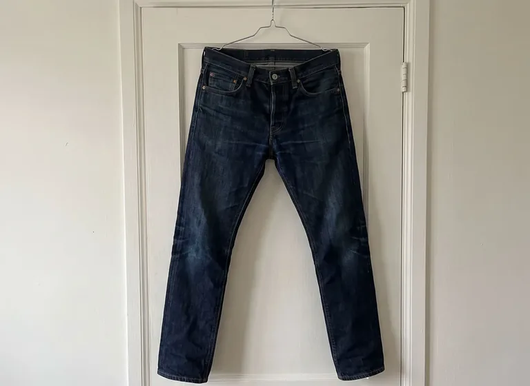 Dark denim jeans on a hanger: the original photo