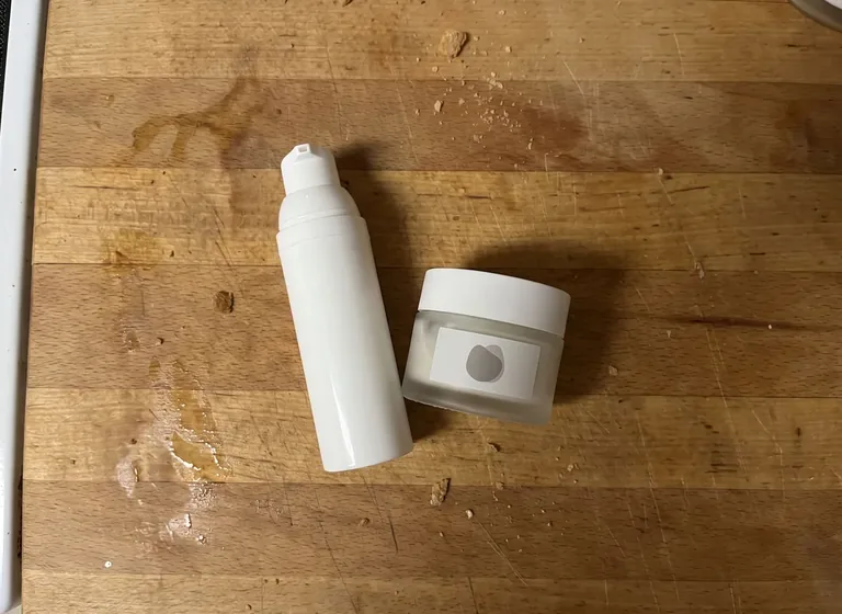Skincare bottle and jar to a styled scene: the original photo